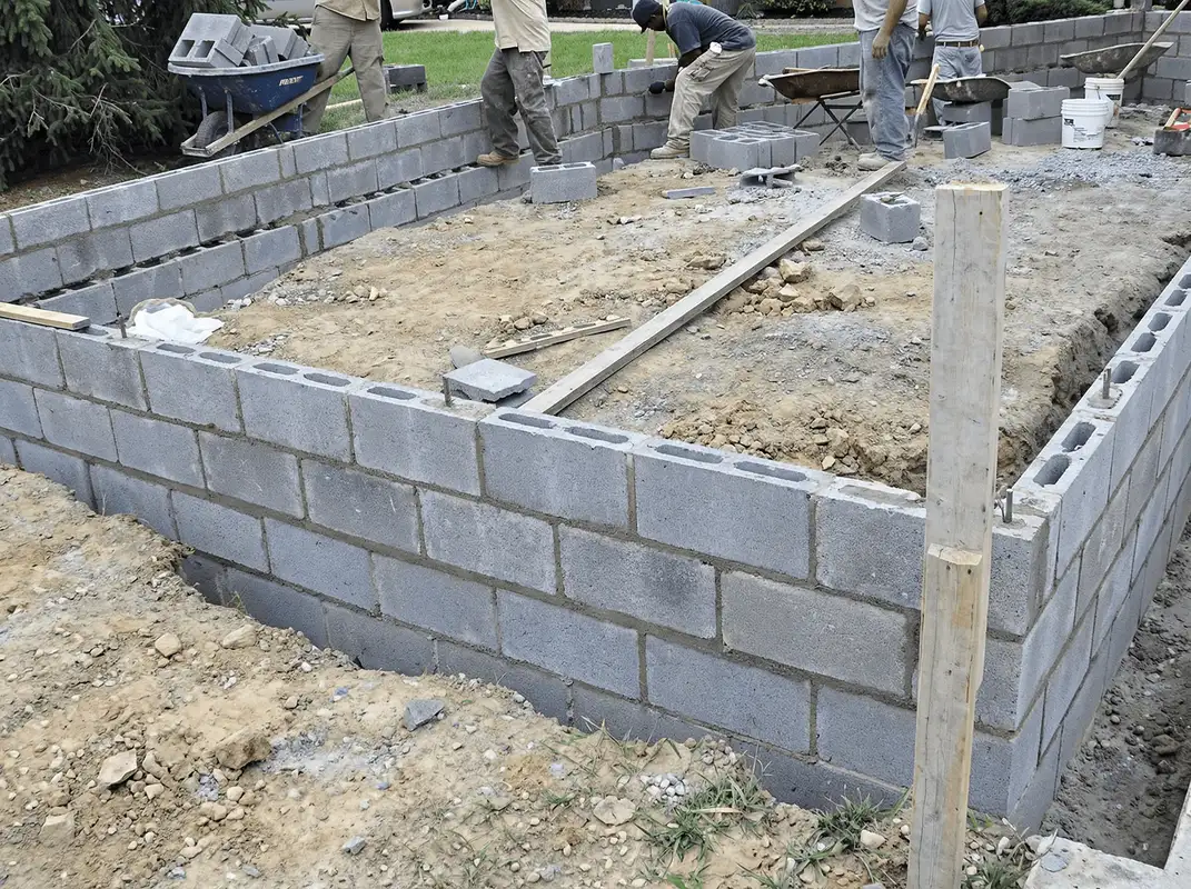 Professionals building a foundation with blocks in Anchorage, AK
