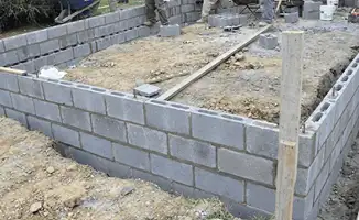 Professionals building a foundation with blocks in Anchorage, AK