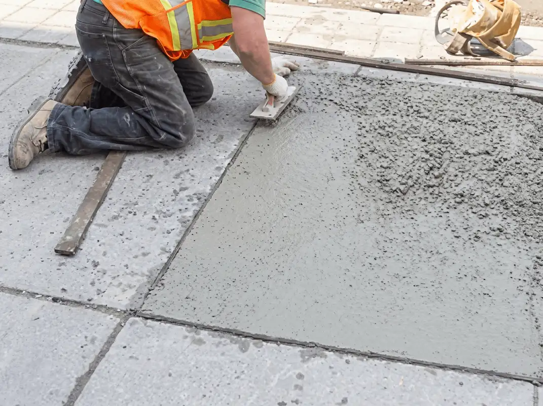 Professional repairing a concrete floor in Anchorage, AK