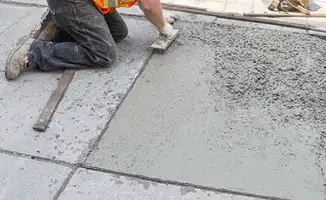 Professional repairing a concrete floor in Anchorage, AK