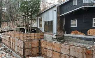 Prepared site with foundation forms for home remodeling and addition project in Anchorage, AK